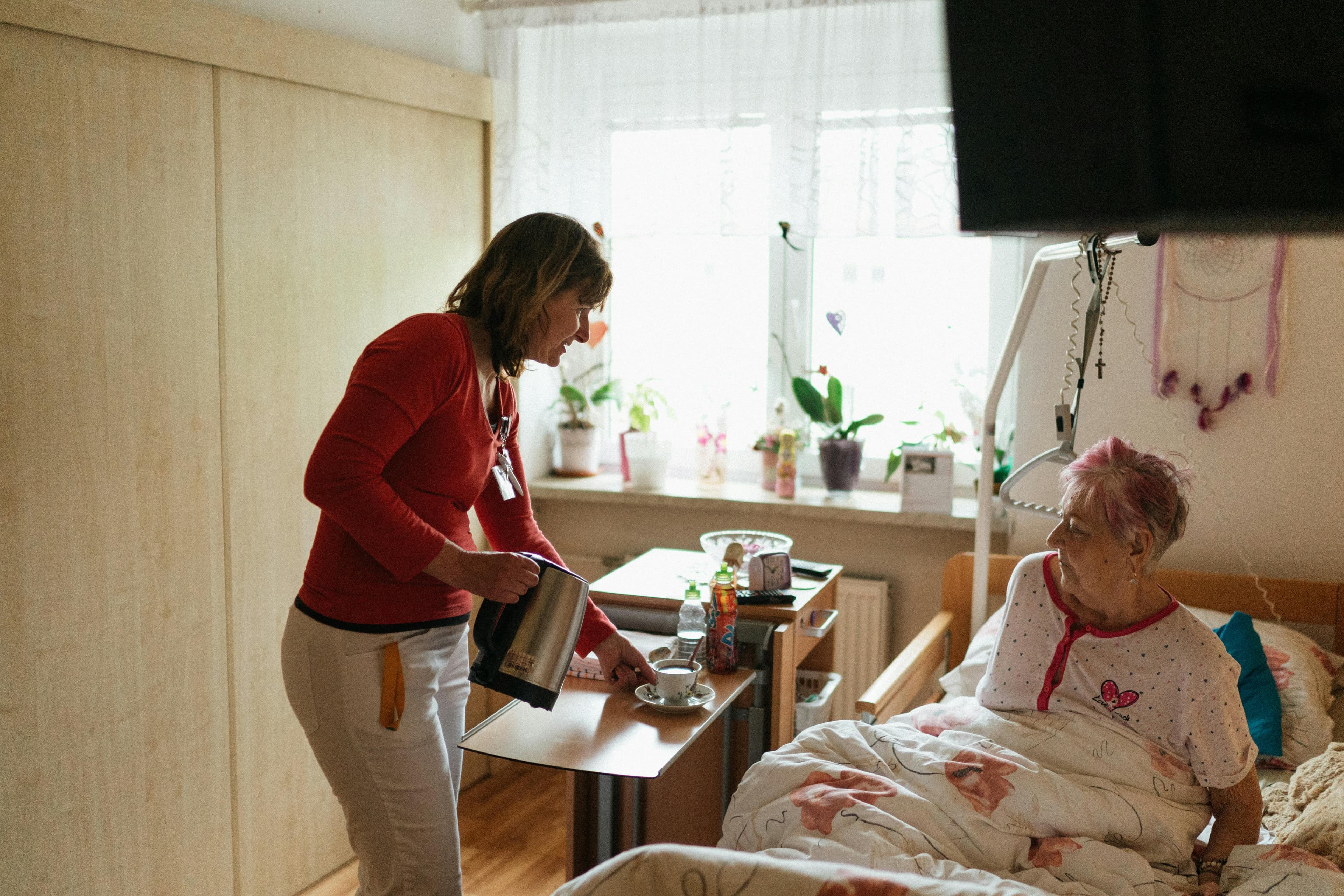 Caregiver sharing a warm moment with a client